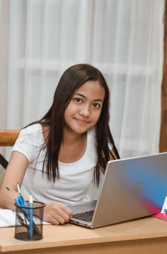 A student working at a laptop